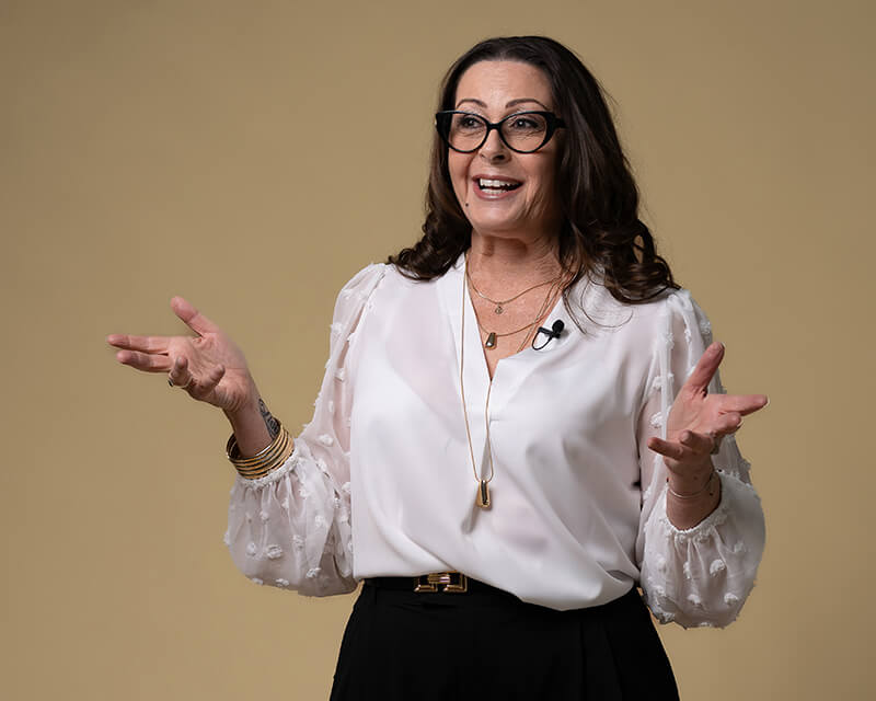 Josee Madison speaking on stage about clarity, resilience, and intentional life design